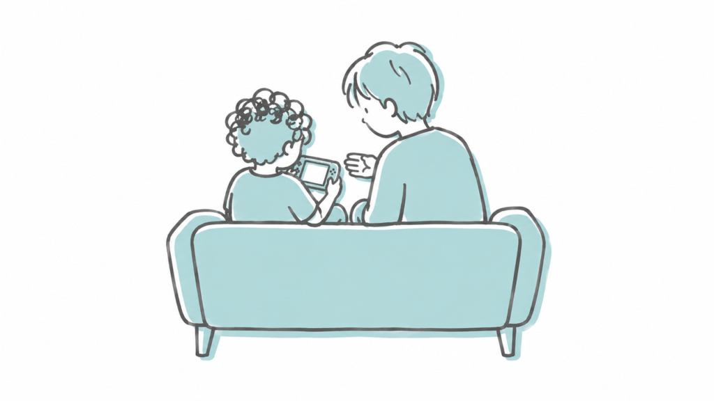 ソファで子どもと大人が並び、ゲームの区切りを話し合う様子